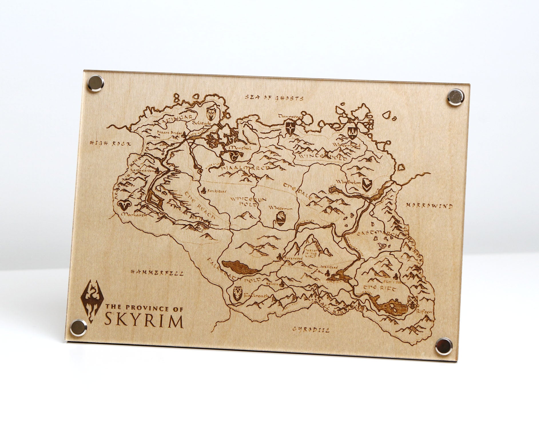 Laser‑engraved Province of Skyrim map on table, featuring detailed etched regions, mountains, and holds inspired by The Elder Scrolls V: Skyrim.