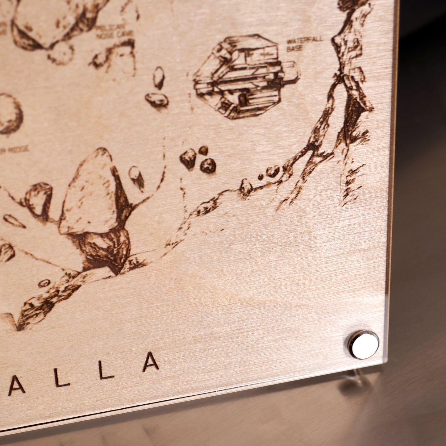Lower right corner closeup of Halo‑inspired Valhalla map art with engraved terrain details in a minimalist LayaBoard frame.