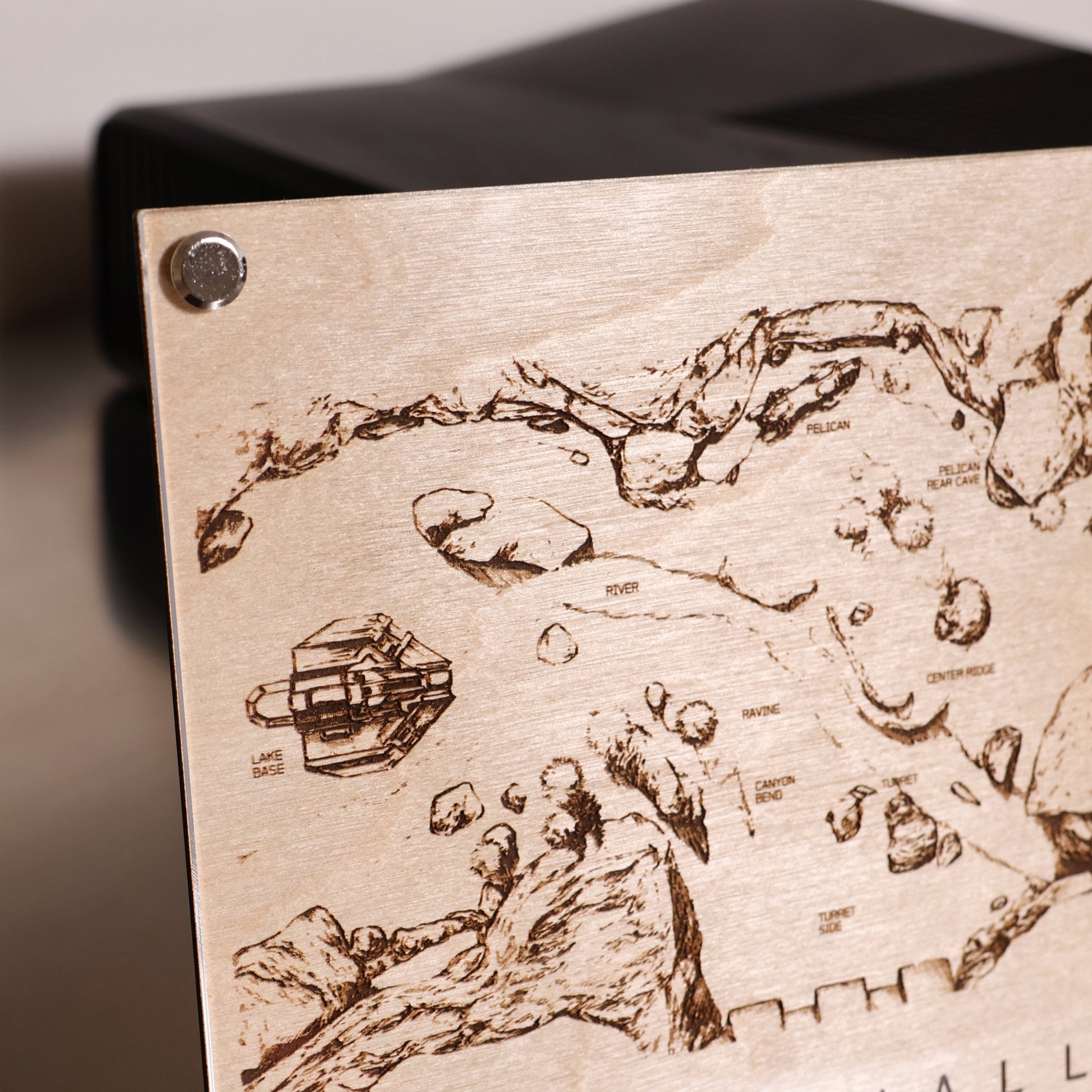 Upper left corner closeup of Halo‑inspired Valhalla map art with engraved terrain details in a minimalist LayaBoard frame.