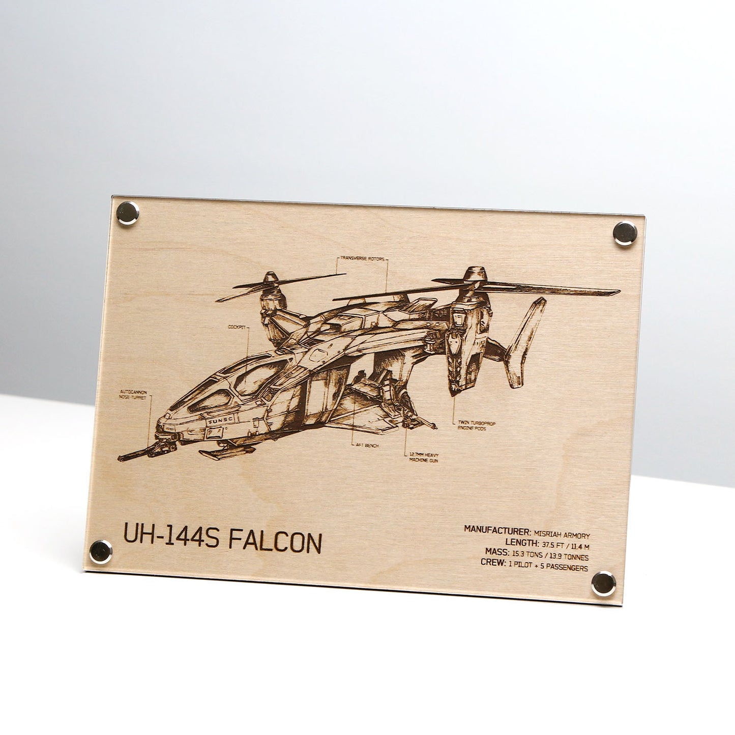 Laser‑engraved UH‑144S Falcon blueprint on LayaBoard displayed on table, featuring detailed twin‑rotor aircraft linework and UNSC‑style technical annotations inspired by Halo.