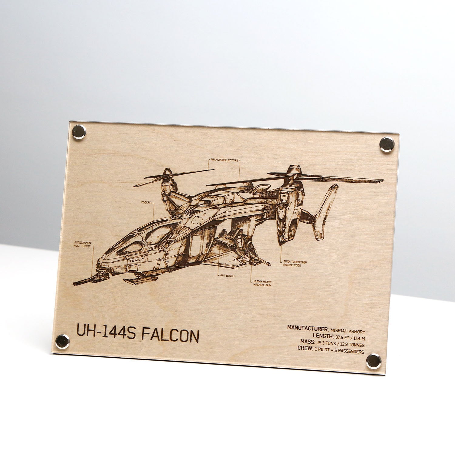 Laser‑engraved UH‑144S Falcon blueprint on LayaBoard displayed on table, featuring detailed twin‑rotor aircraft linework and UNSC‑style technical annotations inspired by Halo.