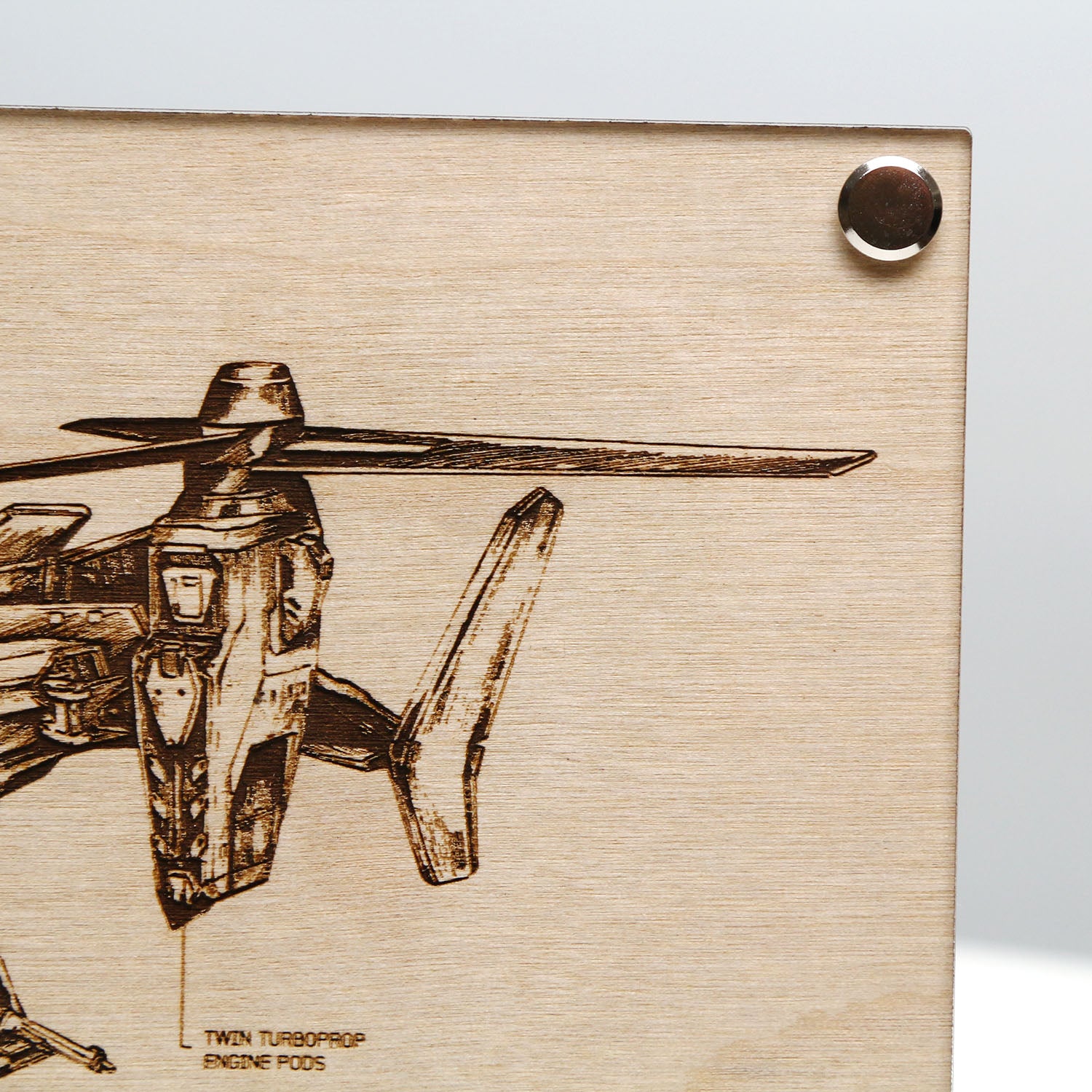 Top right corner closeup of laser‑engraved UH‑144S Falcon blueprint on LayaBoard featuring aircraft linework and UNSC‑style technical annotations inspired by Halo.