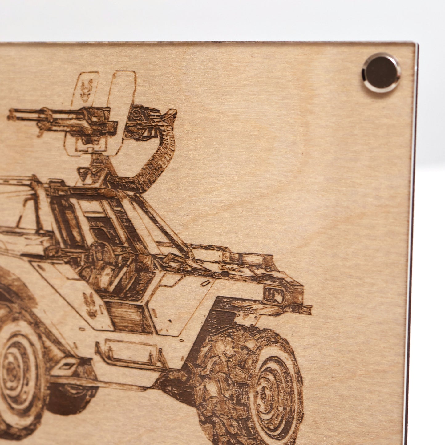 Closeup on upper right corner of laser-engraved Halo UNSC M12B Warthog diagram plaque in LayaBoard frame.