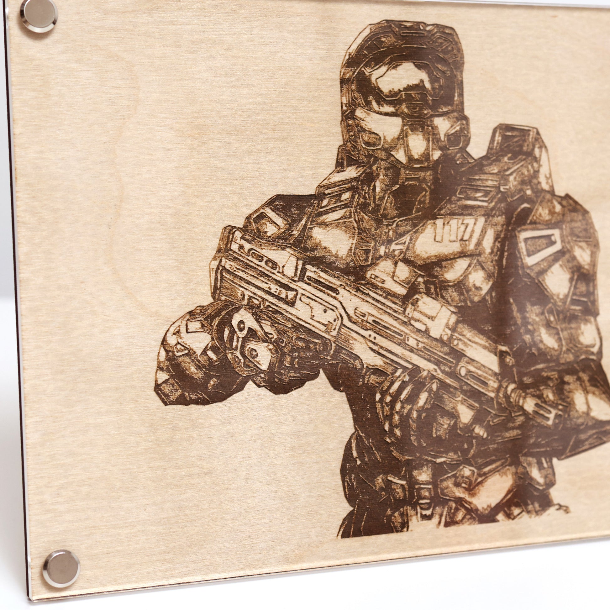 Close‑up of engraved Halo Master Chief portrait with wood frame