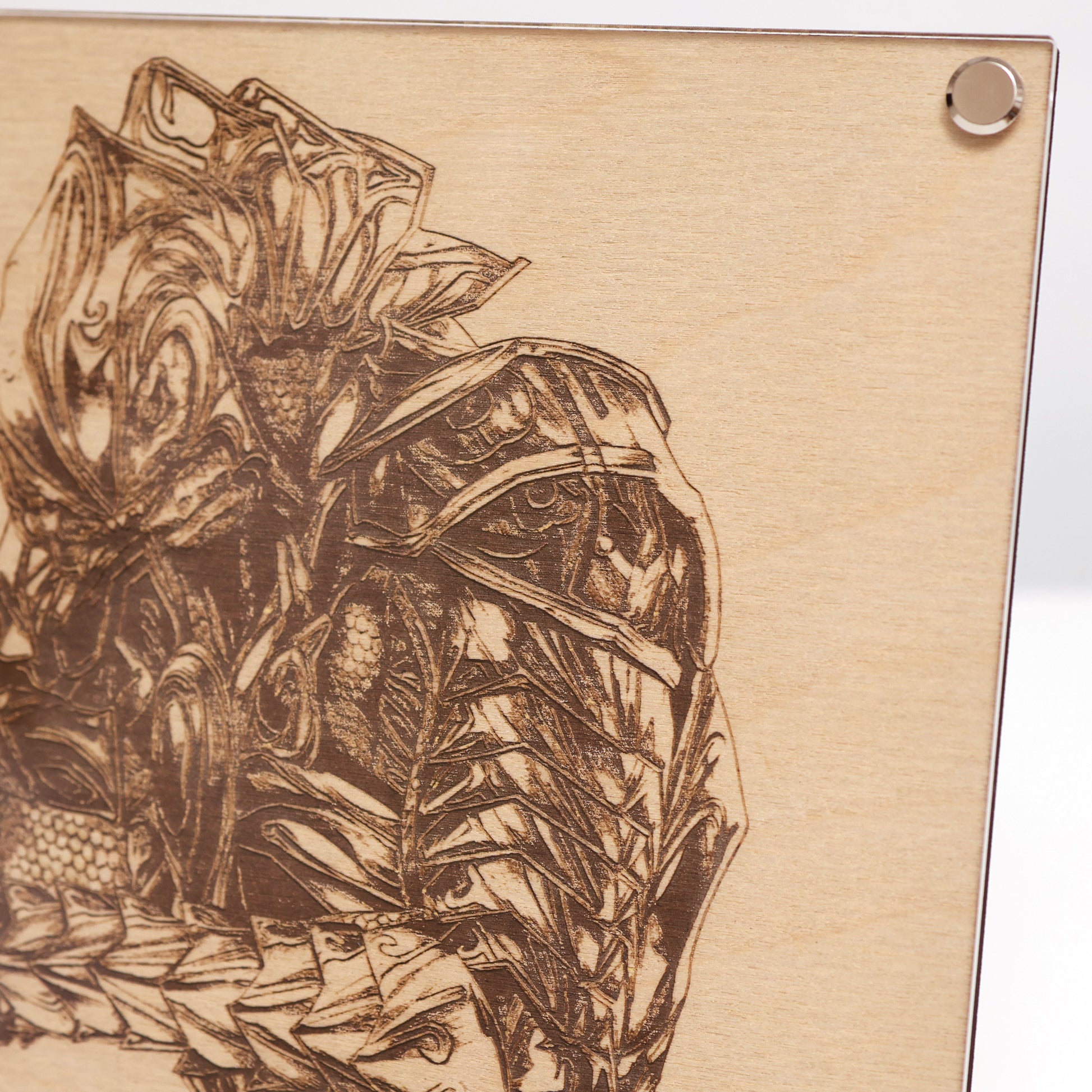 Close‑up on upper right corner of Halo Arbiter portrait engraving with wood frame