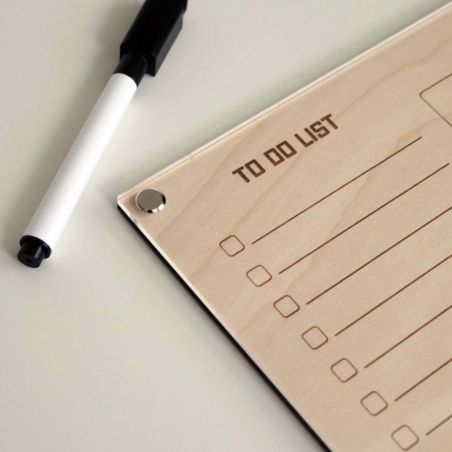 LayaBoard To-Do List Planner – Premium Acrylic Dry Erase Board upper left corner closeup.