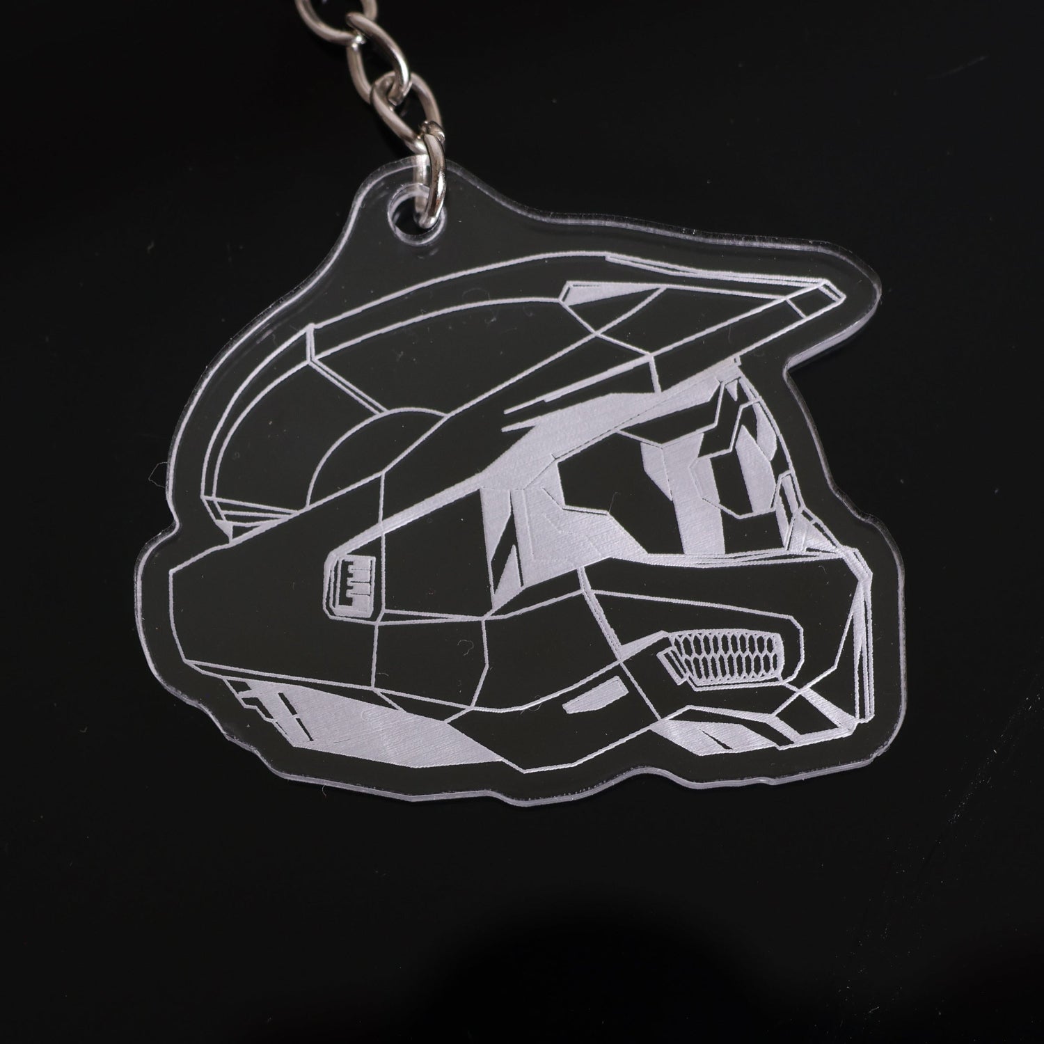 Halo Master Chief Helmet Mark VI keychain made from clear acrylic closeup.