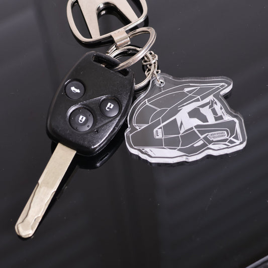 Halo‑inspired acrylic keyring featuring the Master Chief Helmet Mark VI attached to car key.