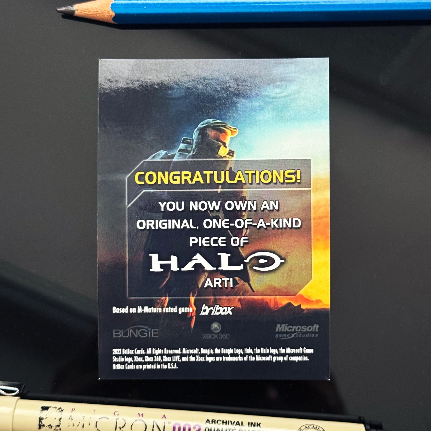 The back of the one‑off Halo Reach Noble Six art card illustrated and signed by Entransing.