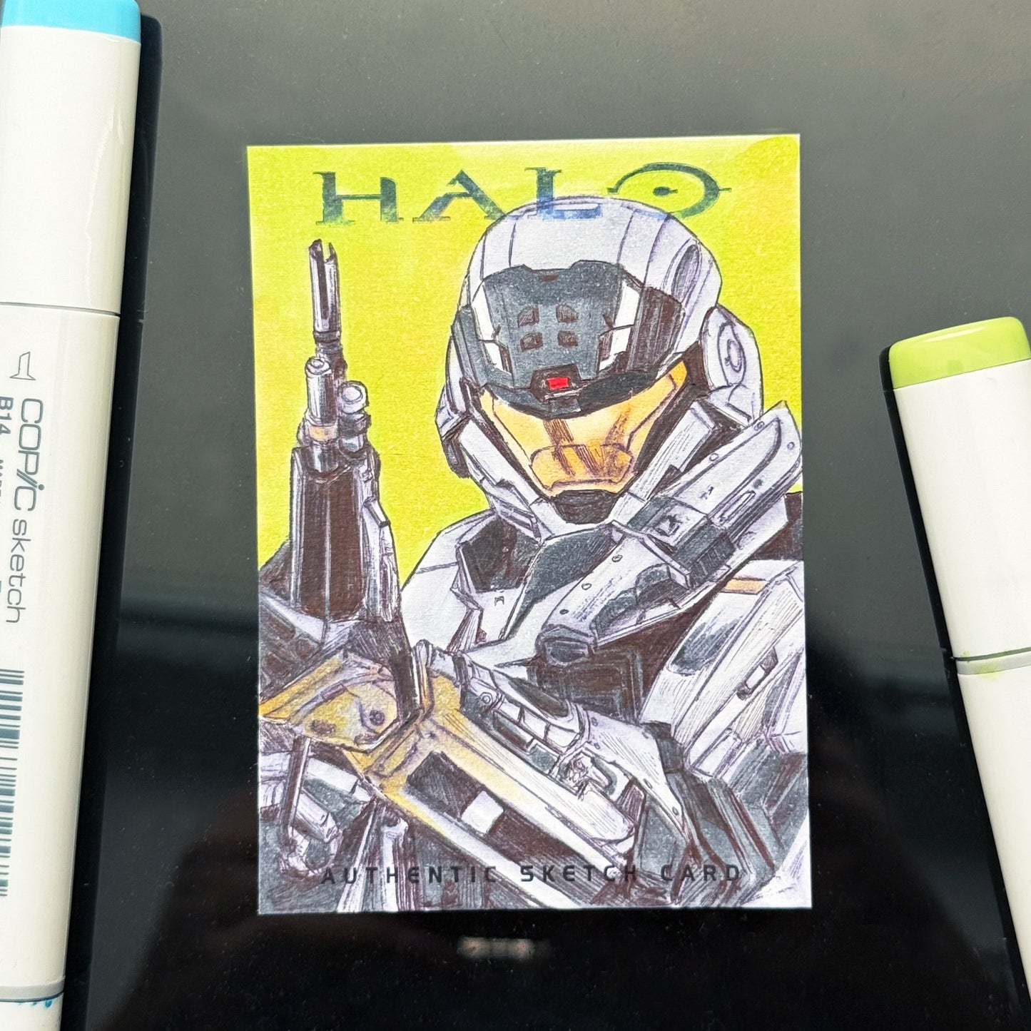 Hand‑drawn Halo Reach Noble Six sketch card with DMR, illustrated by Entransing on premium Community Card stock.