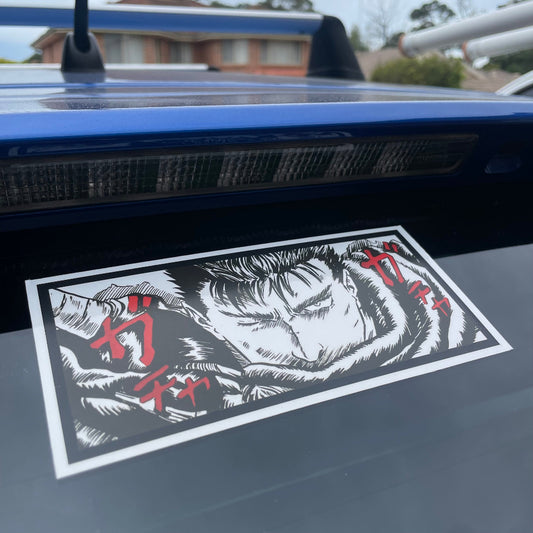 Berserk Guts Panel Decal decorating a car rear window.
