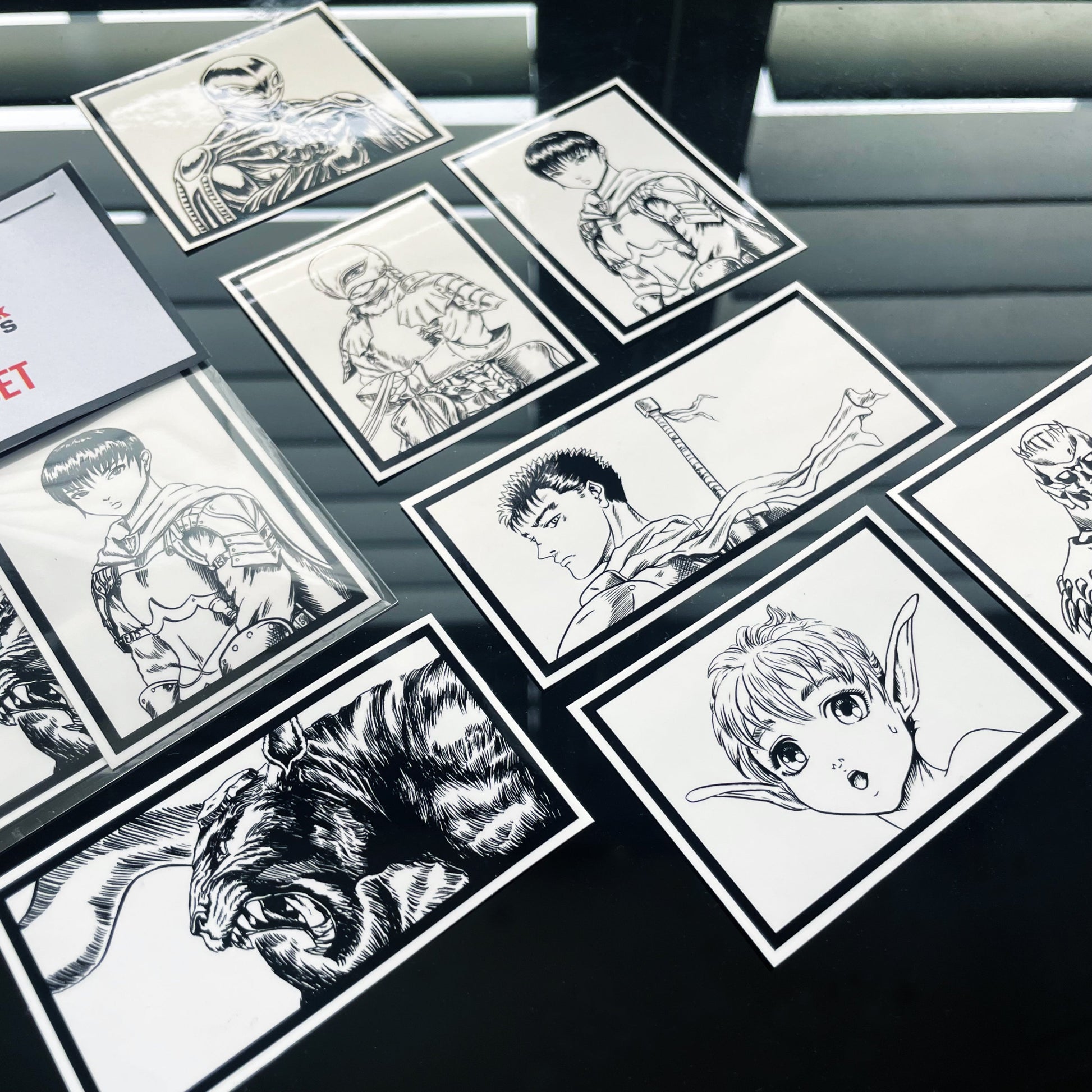 Closeup of 7-piece Berserk sticker pack includes Guts, Griffith, Casca & more