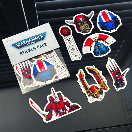 Warhammer 40,000 sticker pack with various character stickers on a dark surface.