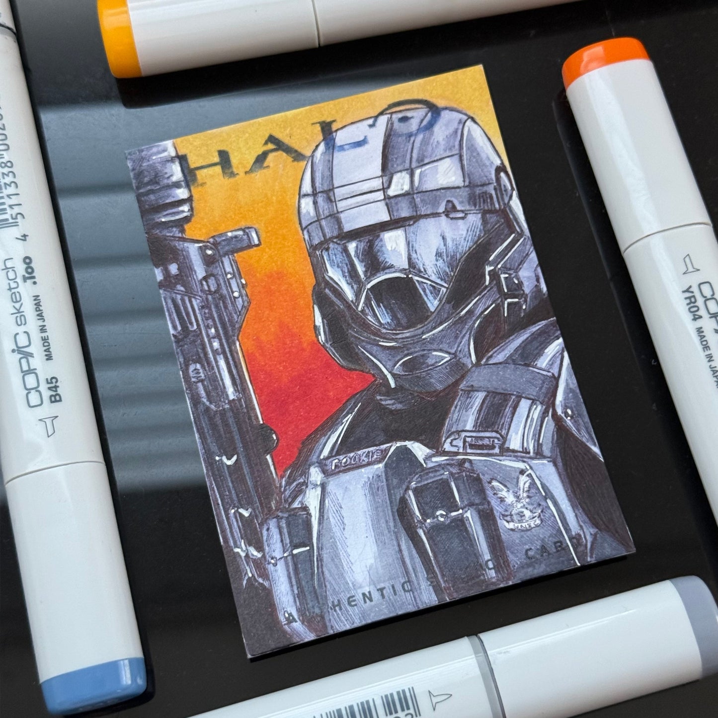 Detailed illustration of The Rookie from Halo 3: ODST on original art trading card.