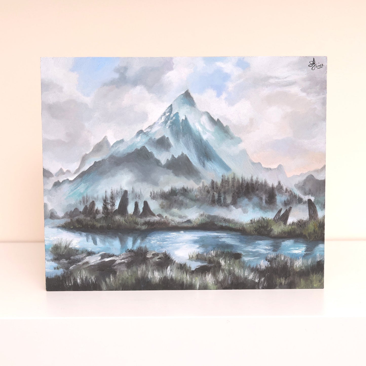 Original oil painting on wood panel depicting the Throat of the World from Skyrim. Features a snow-covered mountain peak rising into a cloudy sky, surrounded by misty ridges and a reflective lake in the foreground. Soft blues, whites, and greens create a tranquil, atmospheric fantasy landscape.