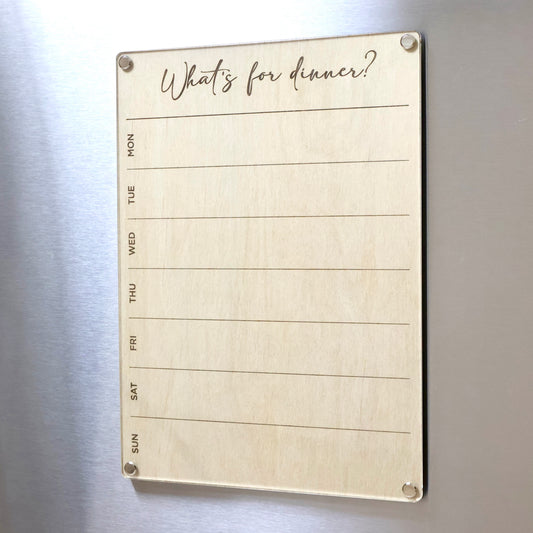 Weekly Meal Planner LayaBoard from Artysn Studio. This premium magnetic whiteboard feature a wood base where the design and text is etched onto. Placed on top is a layer of crystal-clear acrylic that provides a glass-like finish and brilliantly smooth surface for writing on. The metal screws and lugs give the board a premium look and finish.